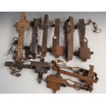 Nine vintage animal traps some maned including examples stamped 'Sidebotham's Genuine', 'Li-Lo', '