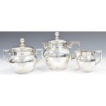 German white metal three piece bachelor's tea set comprising teapot, sugar bowl and lid and milk