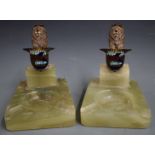 Pair of BARC Brooklands ashtrays, surmounted by cold painted bronze or similar lions holding