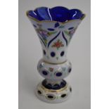 19thC overlaid and cut glass vase with white casing over blue ground, hand decorated with flowers