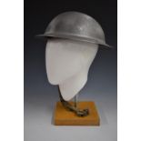 WW2 British 'Brodie' steel helmet stamped HMB 1941 with liner and chin strap together with one other