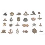 Twenty four British Army officer's collar badges including North Staffordshire Regiment,