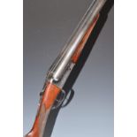 Sabel Gunmark 12 bore side by side shotgun with engraved locks and thumb lever, chequered grip and