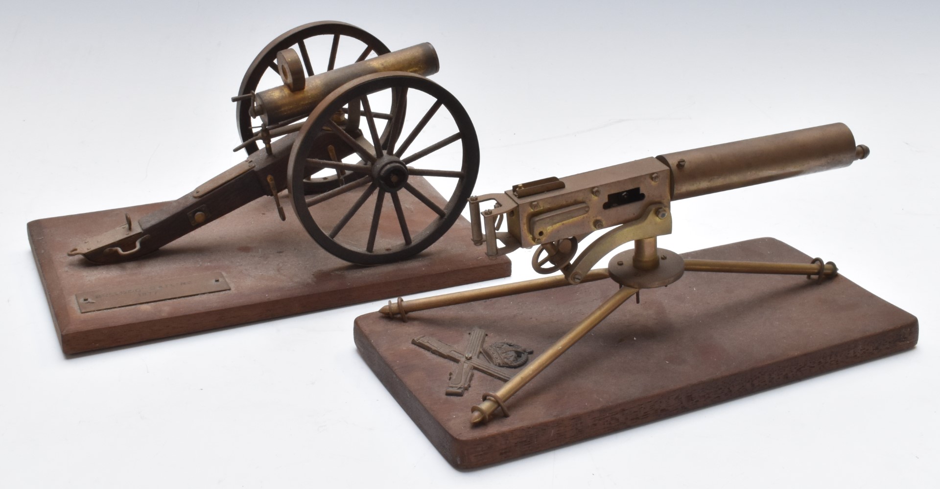 Two model machine guns with moving parts comprising Bullnoze Gatling example and one other, W22 x