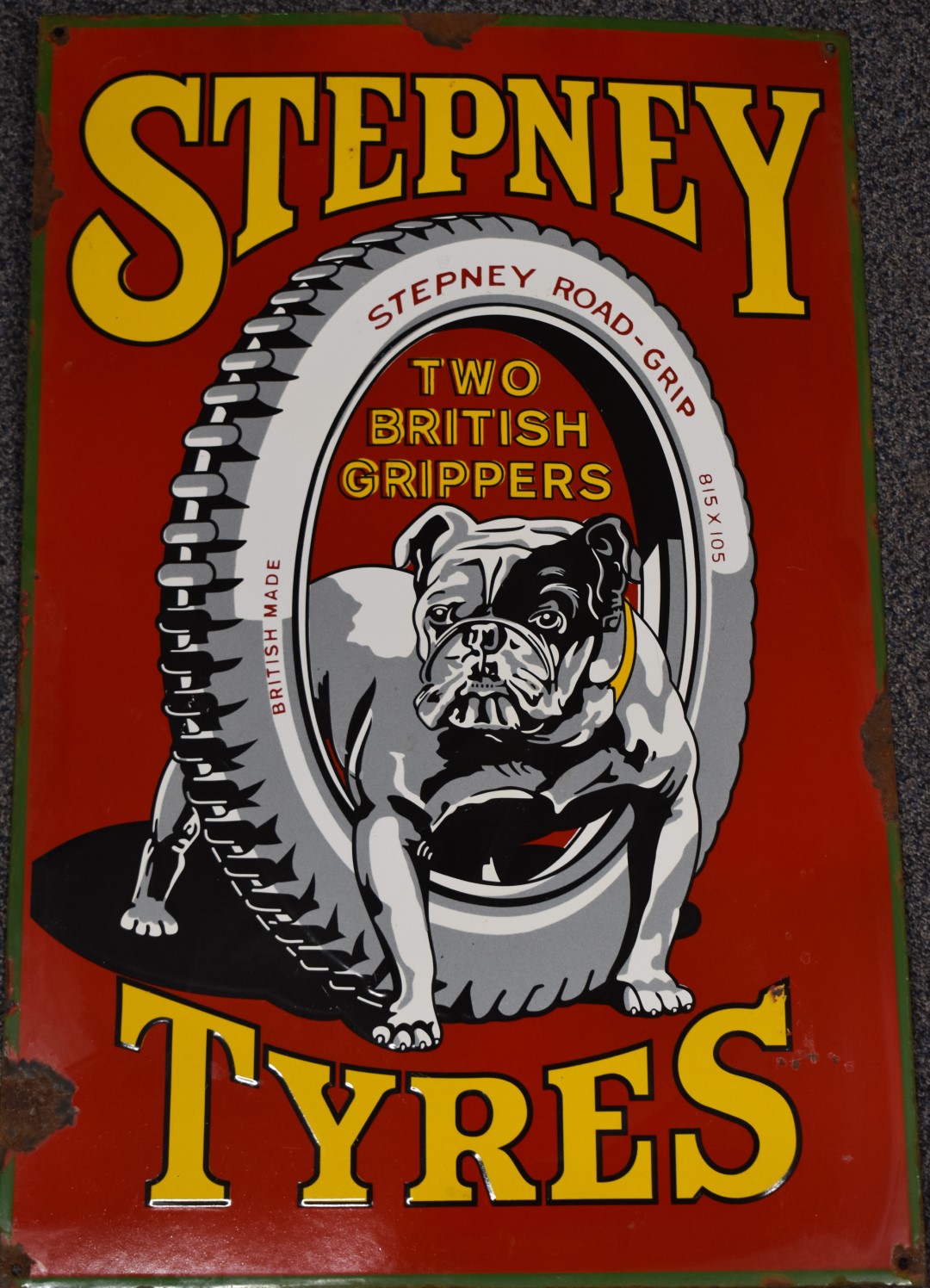 Stepney Tyres enamel car or motorcycle advertising sign depicting a bulldog astride a tyre to the