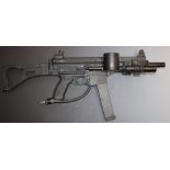 Tippmann assault rifle style paintball gun in carry case with a large quantity of parts and