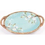 Late 19thC two handled oval majolica dish with floral decoration, length 38cm