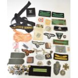 Replica German Nazi cloth and metal badges, cap tally, buttons etc