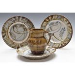 Wenford Bridge Pottery advertising jug and three studio pottery chargers with impressed tree and