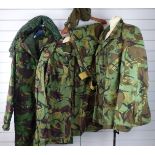 British Cold War DPM clothing comprising two jackets, one pair of trousers and a parka with liner,