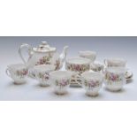 Twenty one pieces of Royal Albert tea ware decorated in the Moss Rose pattern, tallest 14cm