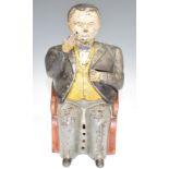 19thC style novelty cast iron 'banker' moneybox, with hinged hand to place the coins in his pocket