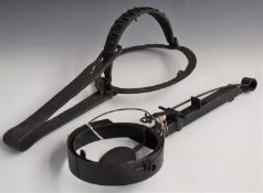 Two vintage large steel and wrought iron animal traps with circular ends, largest 53x25x18cm.