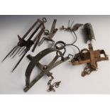 Six various vintage animal traps including a mole trap and one stamped 'Gallie Trap 602'.