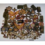 Collection of British Army cloth and metal rank and proficiency badges including Artillery etc