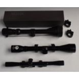 Three air rifle scopes 4x40, BSA 2x and Riflescope 3-9x50 in original box, all with scope mounts.