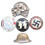 Five German Third Reich Nazi pin badges including an SS example and one marked Reichs Luftschutz