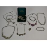 A collection of vintage diamanté jewellery including paste brooch in original box