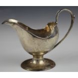Art Nouveau Walker & Hall hallmarked silver sauce boat of flowing naturalistic design, Chester 1906,