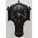 Oak cased c1920 carved drop dial wall clock with Roman brass numerals and three train movement