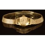 Omega 18ct gold ladies wristwatch with gold hands and baton hour markers, silver dial and signed