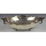 Continental white metal oval bowl with winged cherub handles, raised on four feet, marked 800 to
