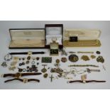 A collection of jewellery including Rotary watch, vintage brooches, necklaces, silver ingot,