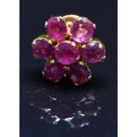 A yellow metal earring set with a cluster of rubies, 1.3g