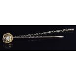 Victorian yellow metal stick pin set with a diamond in a star setting, 2g