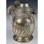 Victorian hallmarked silver presentation lidded jug, with ivory insulated scrolling handle and