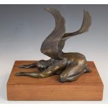 Bronze study of a prostrate winged man raised on a wooden plinth, W24 x D16 x H21cm