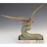 Bronze sculpture of an albatross flying over a cresting wave, on marble base, with impressed Rene