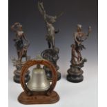 Three spelter figures and a dinner bell, tallest 52cm