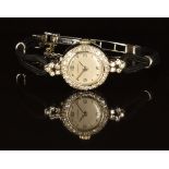 Marvin platinum diamond set ladies wristwatch with silver hands, hour markers and dial, on black