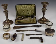 Hallmarked silver items to include pair of candlesticks, cased manicure set, cased thimble, silver