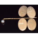 A pair of Art Deco 9ct gold cufflinks, Birmingham 1934, 9.5g and a yellow metal stick pin set with a