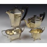 George V hallmarked silver four piece tea set of octagonal form, each pieced raised on four feet,