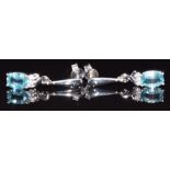 A pair of 9ct white gold earrings set with an oval aquamarine and diamonds to each, 3.1g