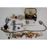 A collection of costume jewellery including 9ct gold cufflinks (5.3g), 9ct gold brooch set with