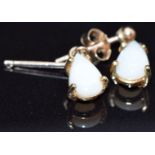 A pair of 9ct gold earrings set with pear cut opals, 1g