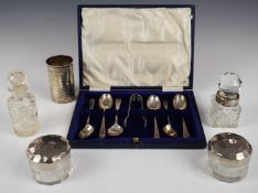 Cased set of hallmarked silver sugar tongs and a hallmarked silver bottle holder, weight of spoons