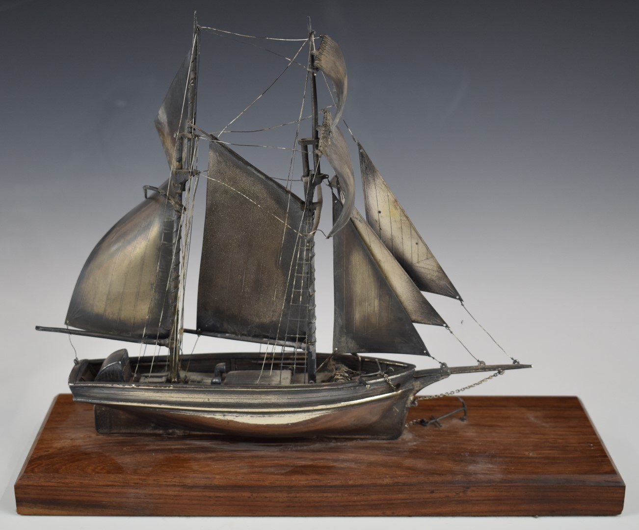 Hallmarked silver model of a sailing boat and tender, London 1980, maker Ammonite Ltd, on wooden - Image 3 of 6