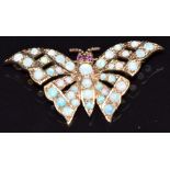 A 9ct gold brooch in the form of a butterfly set with opals and ruby eyes, 4.9g