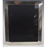 Modern hallmarked silver photograph frame to suit 10 x 8 inch photo, with velvet easel back,