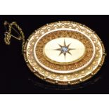 Victorian Etruscan Revival yellow metal brooch set with an old cut diamond in a star setting