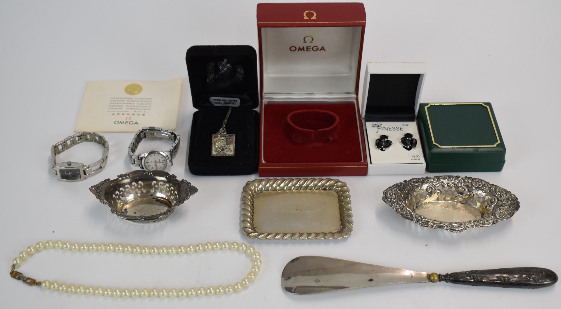 A collection of costume jewellery, two silver dishes, silver necklace, watches, Omega watch box,