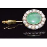 Victorian stick pin set with an oval cut agate surrounded by split pearls, 11.1g