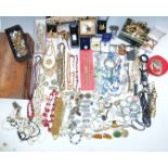 A collection of costume jewellery including pearl bracelets, vintage brooches including Sphinx,