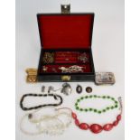 A collection of costume jewellery including Wedgwood pendant, silver locket, ingot, earrings etc