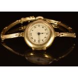 Unnamed 18ct gold ladies wristwatch with blued hands, black Arabic numerals, silver dial and